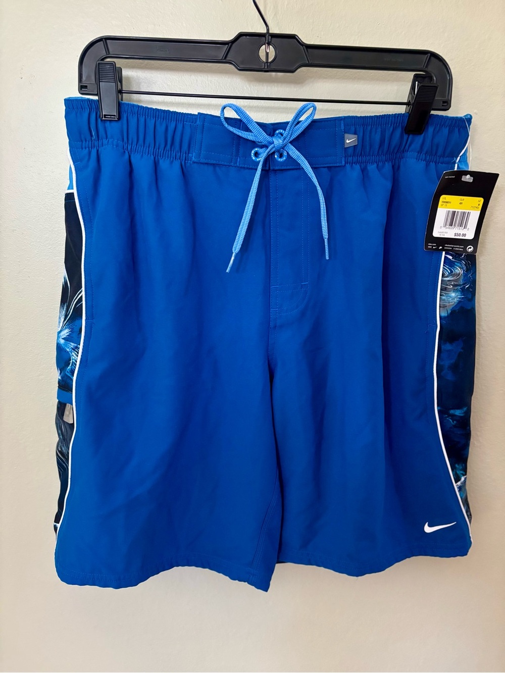 NWTs!! Nike Men's Royal Blue Swim Shorts with Abstract Floral Side Panel Design.